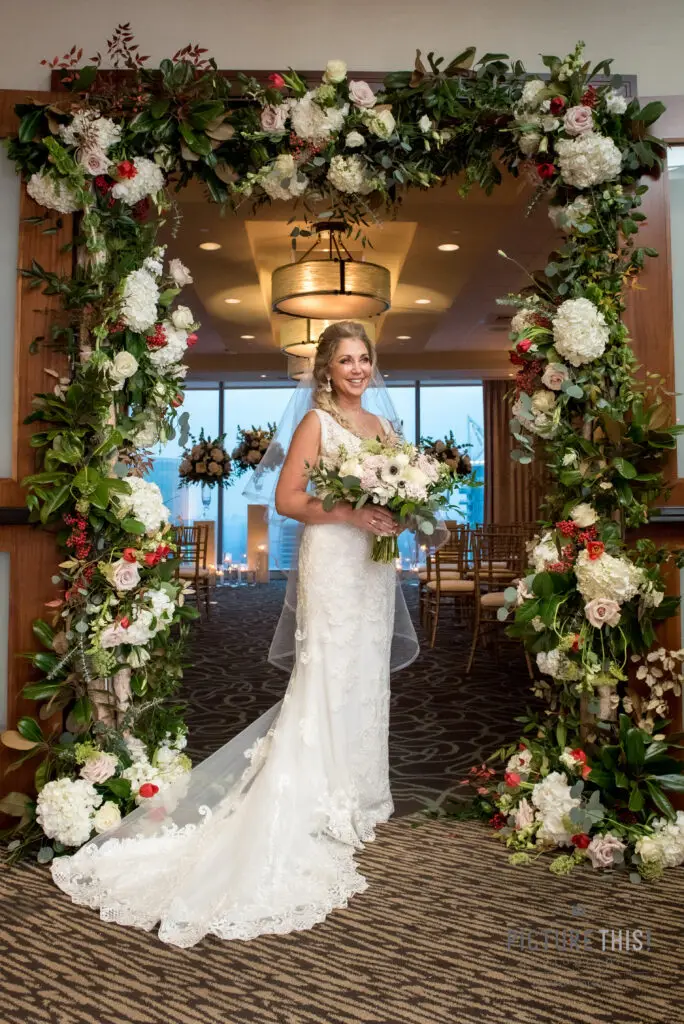Grand floral installation over an event tablescape